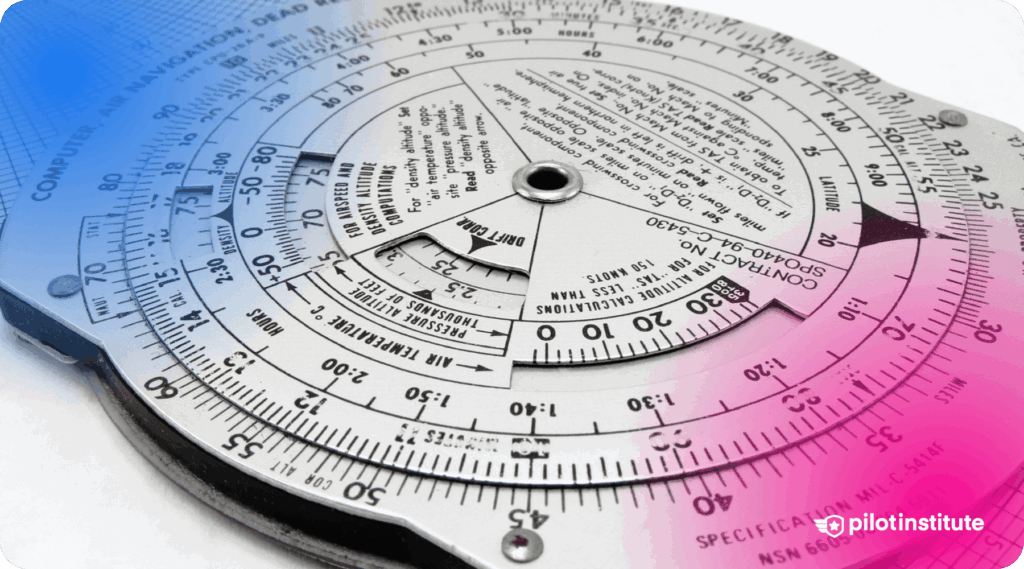 Close-up of an E6B flight computer, a circular slide rule used by pilots for navigation, wind correction, and flight planning calculations.