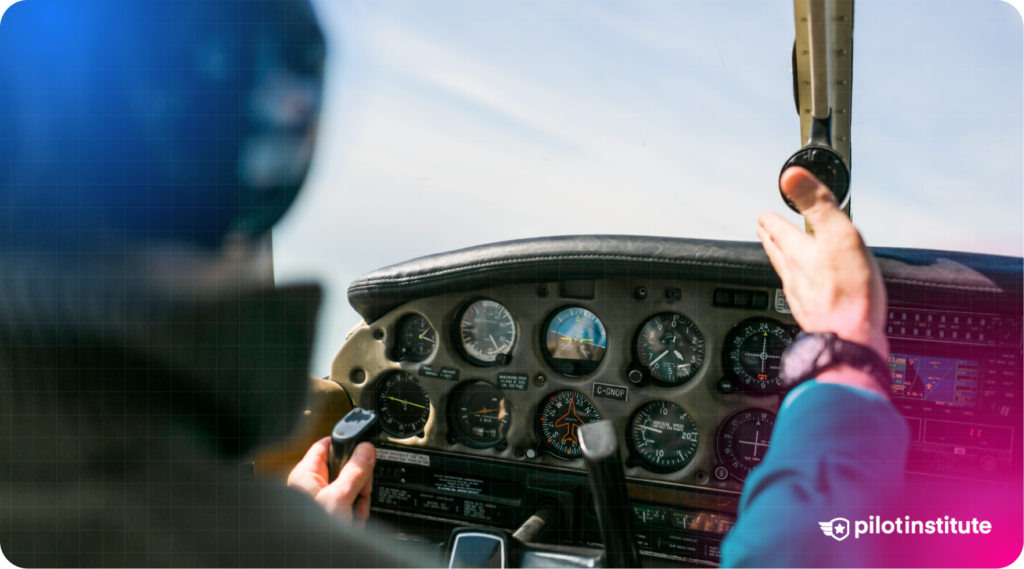 Pilots in a small aircraft cockpit with analog flight instruments, one gesturing toward the panel.