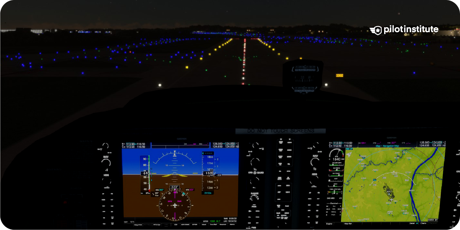Cessna cockpit showing a long landing with the end of the runway ahead.