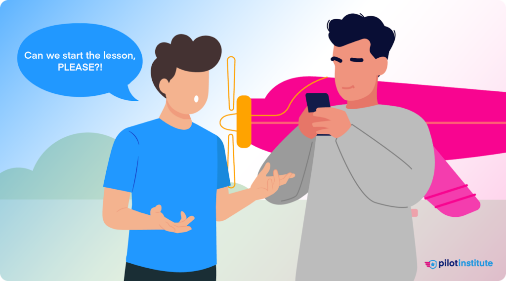 An instructor stares at their cell phone, ignoring the student.
